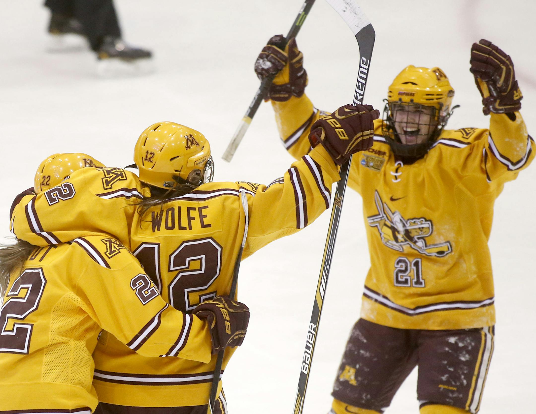 Minnesota's Megan Wolfe (12) celebrates an assist with teammates Hannah Brandt (22) and Dani Cameranesi (21) during the second period of the Gopher's 3-1 win over Wisconsin in the Women's NCAA Frozen Four hockey semifinals Friday, March 20, 2015, at Ridder Arena in Minneapolis.](DAVID JOLES/STARTRIBINE)djoles@startribune.com Women's NCAA Frozen Four hockey semifinals Friday, March 20, 2015, at Ridder Arena in Minneapolis.