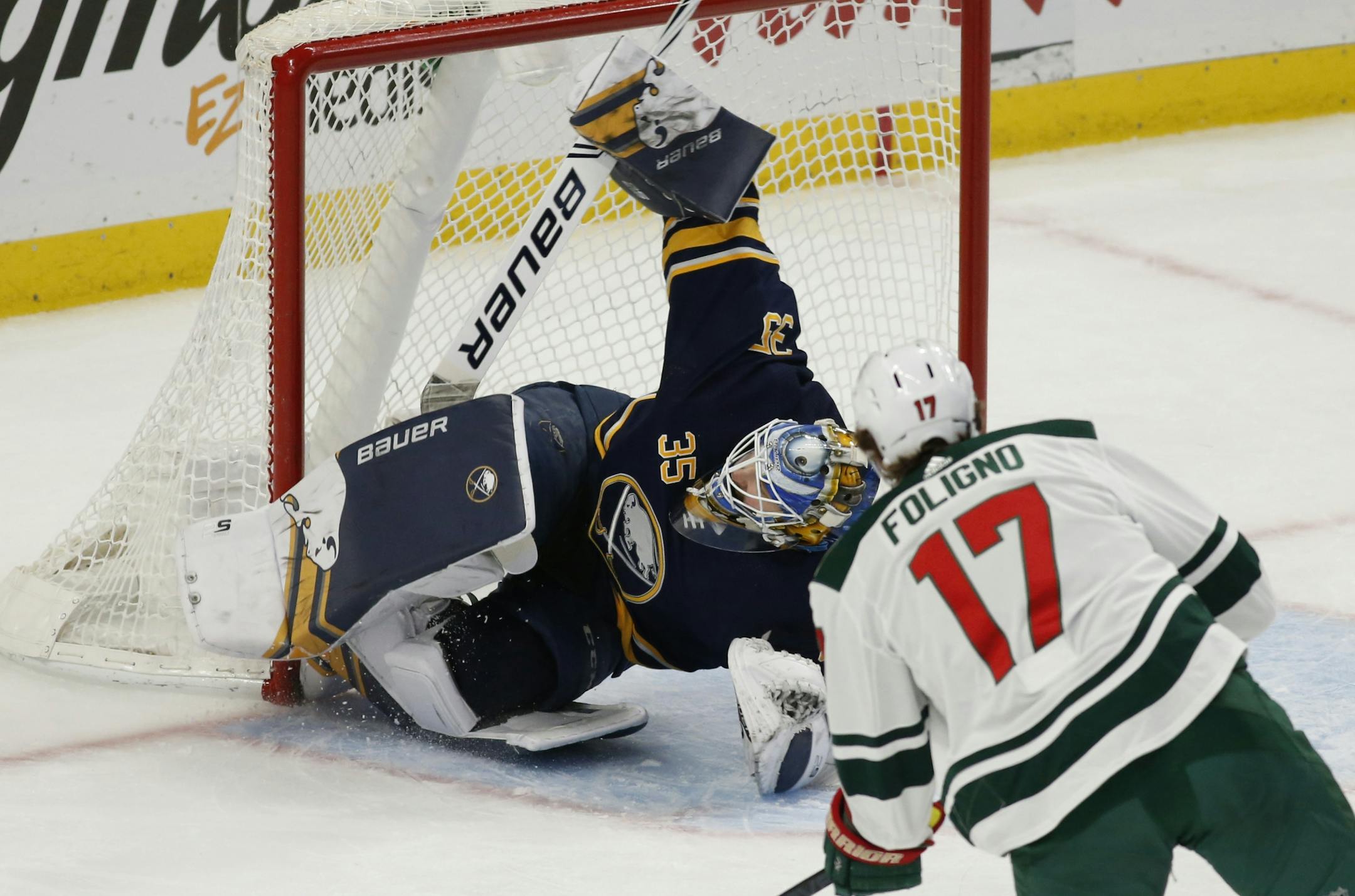 Buffalo Sabres goalie Linus Ullmark (35) stops Minnesota Wild forward Marcus Foligno (17) during the first period of an NHL hockey game, Tuesday, Feb. 5, 2019, in Buffalo N.Y.