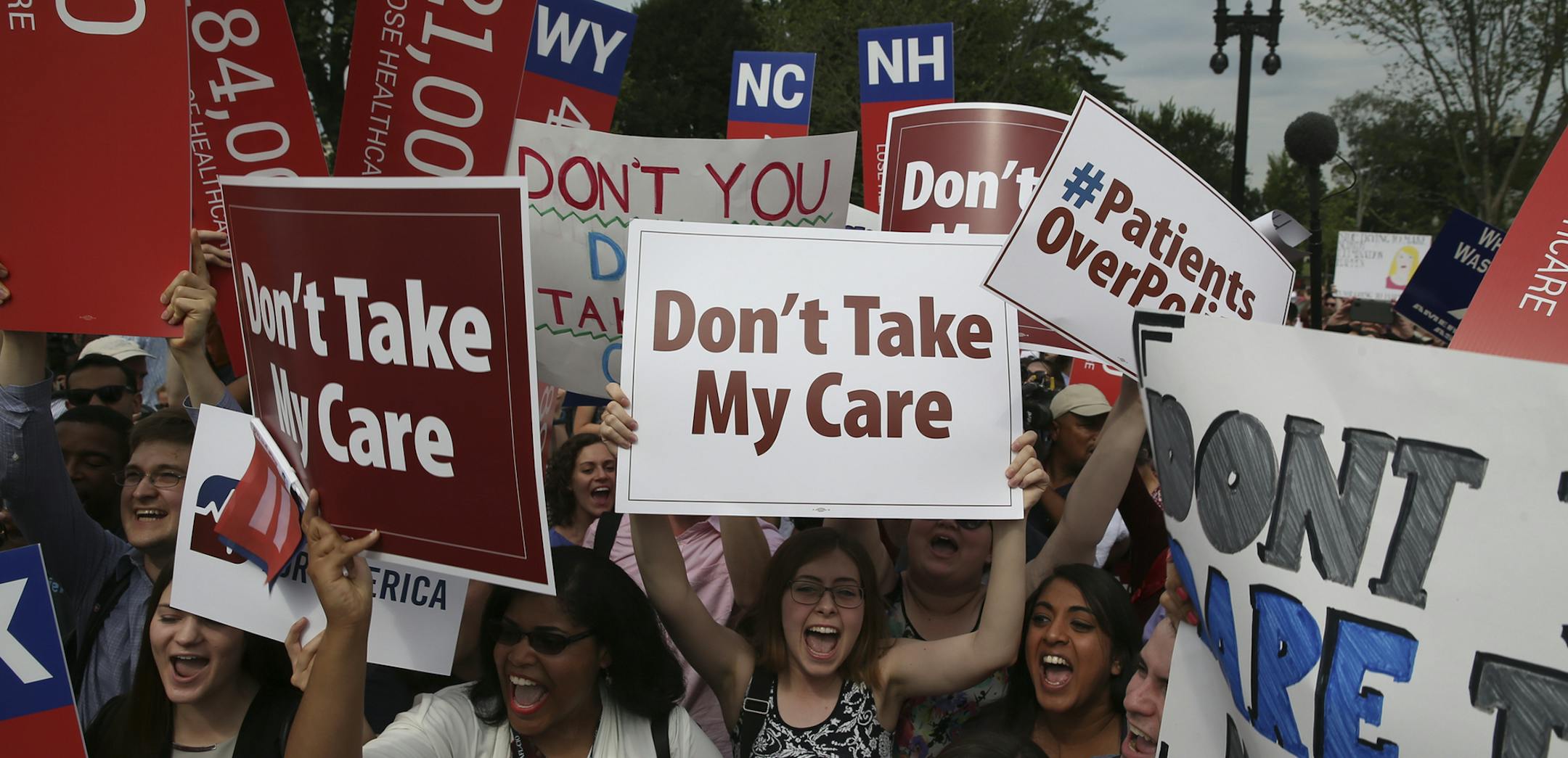 Demonstrators in support of the Affordable Care Act outside the U.S. Supreme Court in Washington, June 25, 2015. The Supreme Court ruled on Thursday that President Obama&#xed;s health care law may provide nationwide tax subsidies to help poor and middle-class people buy health insurance. (Doug Mills/The New York Times) ORG XMIT: MIN2015062510563822