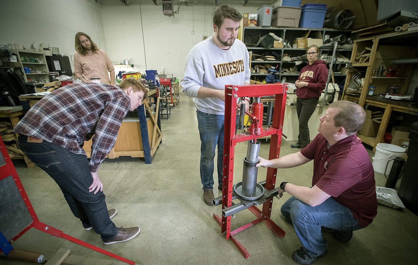 University of Minnesota students, from left, Ethan Brownell, Robert Belar, Luke Bromback, Elizabeth Vertina and Daniel Ross worked on their machine.