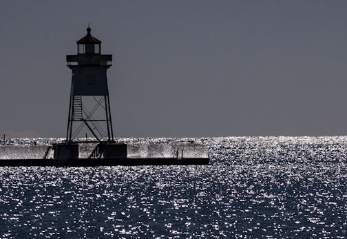 Grand Marais Lighthouse stood tall among the sparkling waters of Lake Superior on Friday. ]
ALEX KORMANN &#x2022; alex.kormann@startribune.com n Cook County, where Twin Cities residents are tempted to go to spread apart and spend time in virus-free nature, not all the locals will be welcoming. A bit of a battle is brewing over trying to get tourists to stay away and keep COVID-19 out of northeast Minnesota.