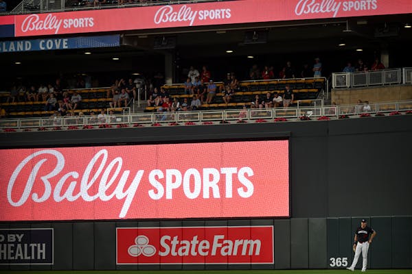 Bally Sports advertisements in right field as Minnesota Twins right fielder Max Kepler (26) waits for a pitch against the Boston Red Sox Tuesday, June