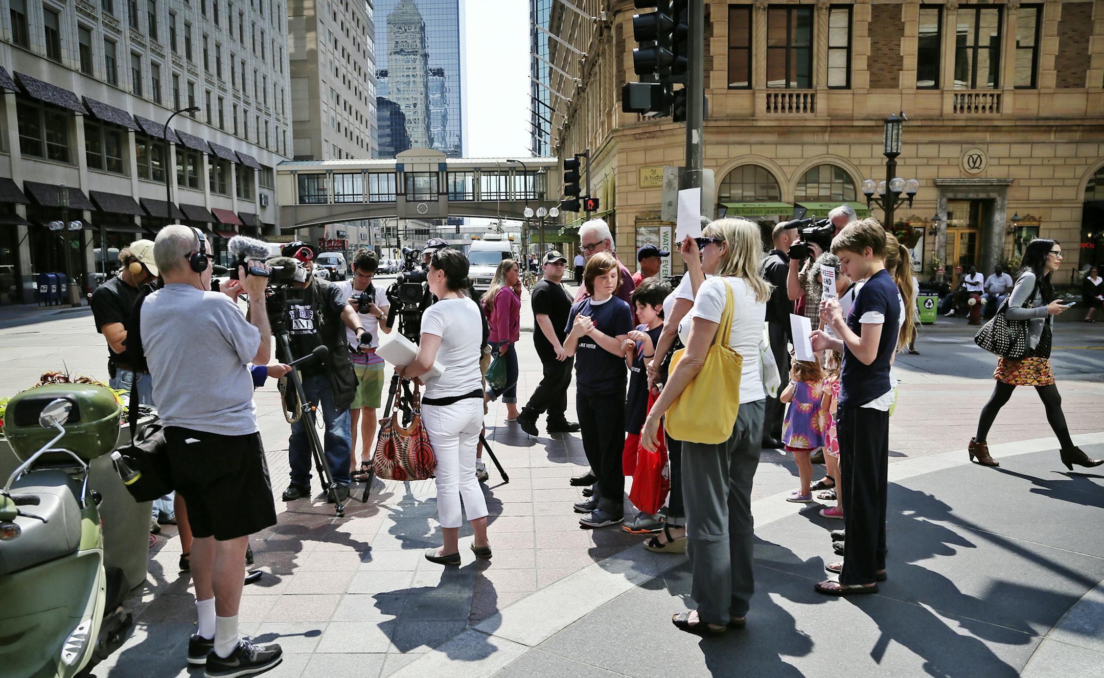 Local members of Moms Demand Action for Gun Sense in America gathered outside the downtown Target Store on the Nicollet Mall to protest Target's policy of allowing long guns in Target stores in other states Wednesday, June 11, 2014, in Minneapolis, MN. Here, Here, Leah Auckenthaler, the group's chapter leader, talked to media members before delivering the petition to the manager of the Target store where she said "she has been shopping there forever." Aukenthaler also said she, her children and