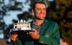 Scottie Scheffler got his first green jacket and first Masters trophy on Sunday after winning the tournament by three shots. 