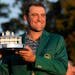 Scottie Scheffler got his first green jacket and first Masters trophy on Sunday after winning the tournament by three shots. 