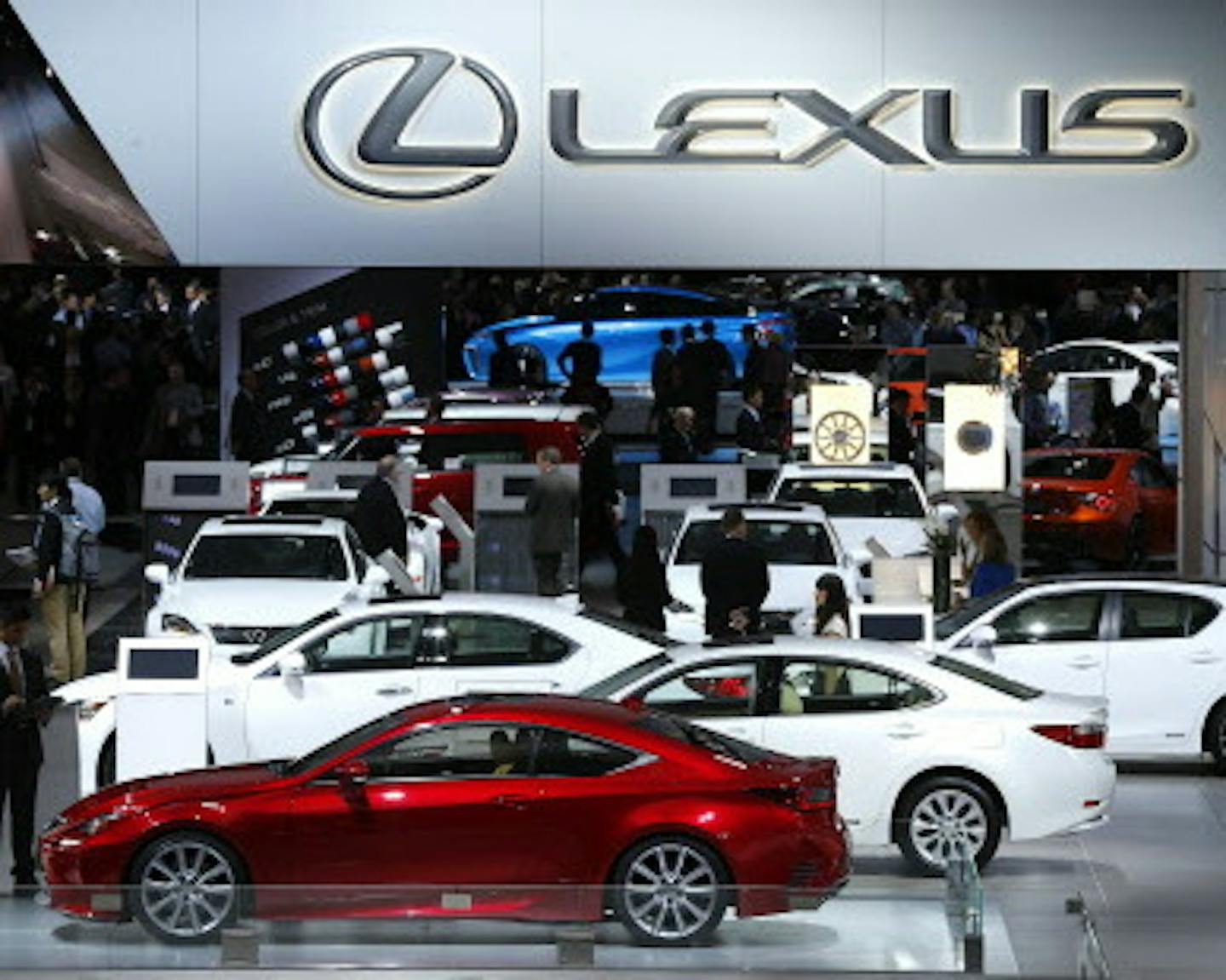 FILE - In this Jan. 13, 2014 file photo, attendees browse through the Lexus exhibit during media previews at the North American International Auto Show in Detroit. Lexus, Porsche and Buick are the most dependable vehicle brands, according to a new study by the consulting firm J.D. Power. (AP Photo/Paul Sancya, File)