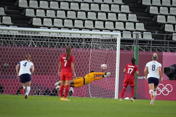 Jessie Fleming of Canada (17) scores past goalkeeper Adrianna Franch of the United States during their semifinal match.