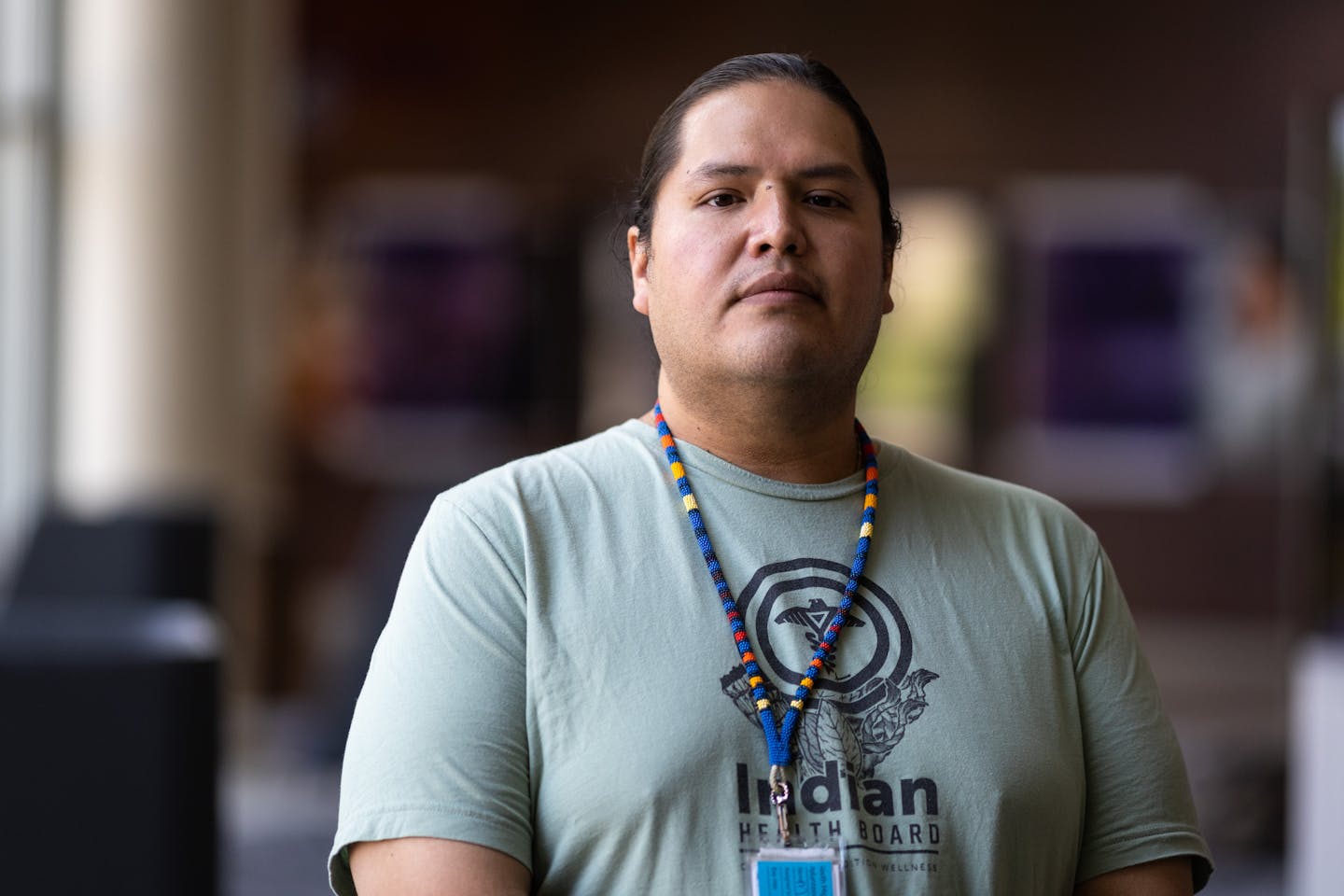 Micah Prairie Chicken, a post-doctoral fellow in clinical psychology at the Indian Health Board of Minneapolis and enrolled member of the Oglala Lakota Oyate, poses for a photo inside the Anderson Student Center at the University of St. Thomas in St. Paul on Wednesday, June 21, 2023.