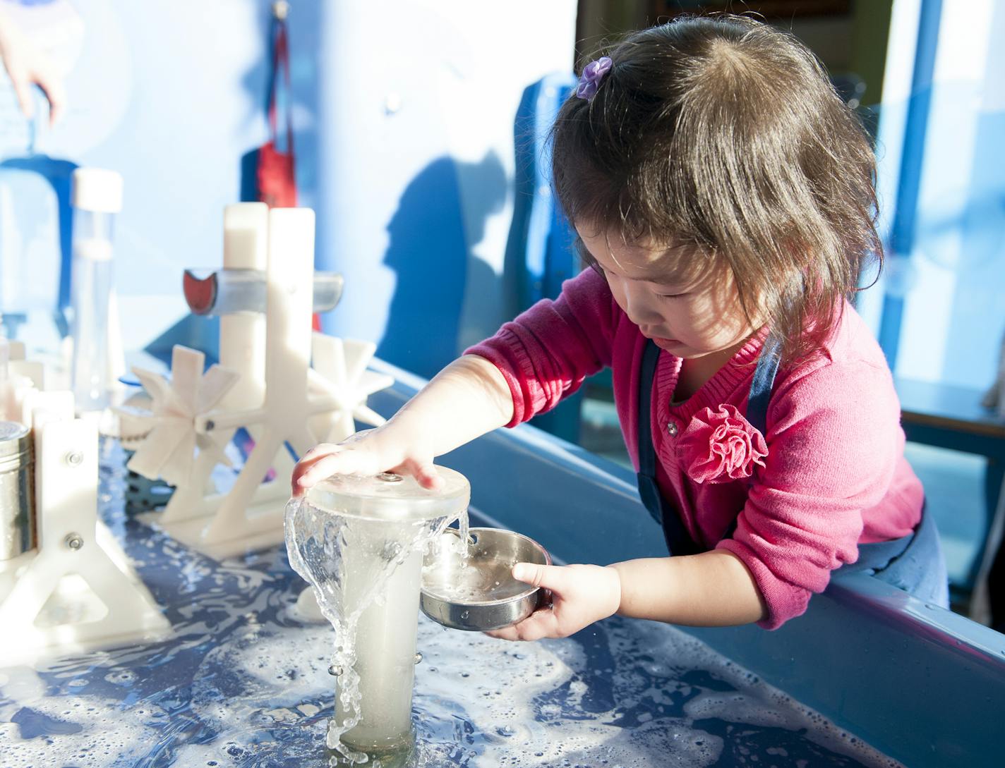 Lana Vue, 2, plays with water at the Minnesota Children's Museum in St. Paul on March 28, 2015. ] Photo by Leslie Plesser &#xef; Special to the Star Tribune