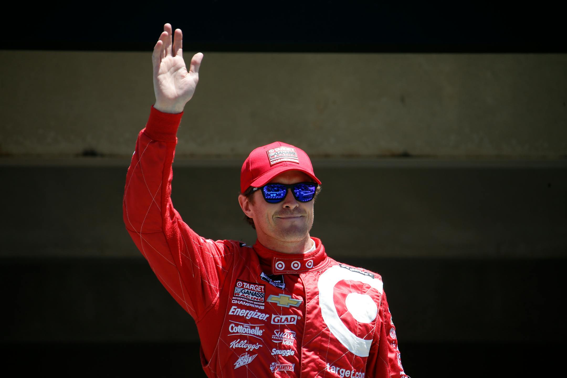 Scott Dixon, of Australia, waves before competing in the Pocono IndyCar 500 auto race, Sunday, July 6, 2014, in Long Pond, Pa. (AP Photo/Matt Slocum)