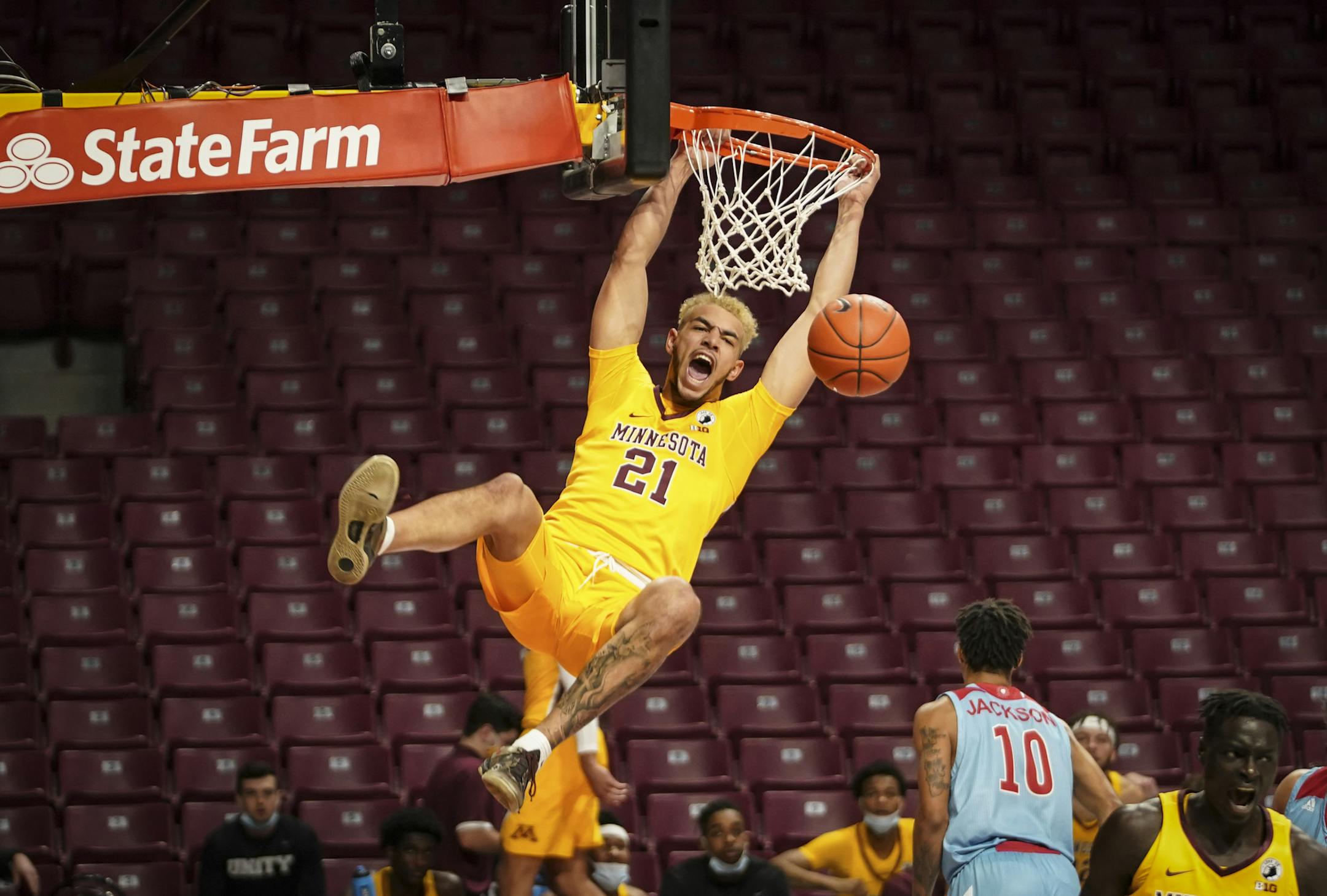 Gophers forward Jarvis Omersa always brings boundless enthusiasm, whether it's from the bench or finishing dunks against Loyola Marymount.