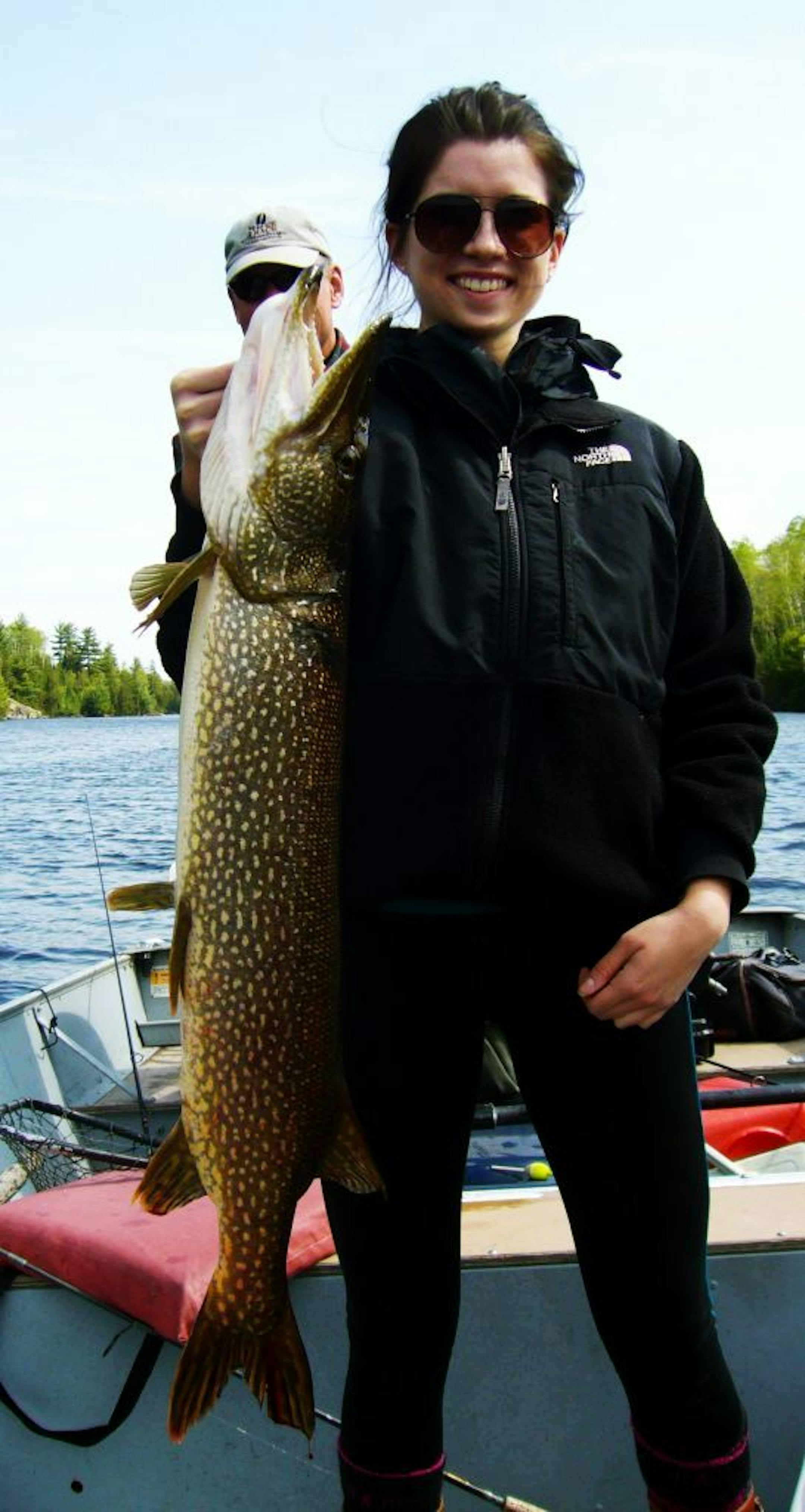 FIRST TIME FISH Michelle DeKenis of Cambridge, Mass, who graduated this spring from Macalester College in St. Paul, caught this 37-inch northern in the BWCA during her first-ever fishing trip.