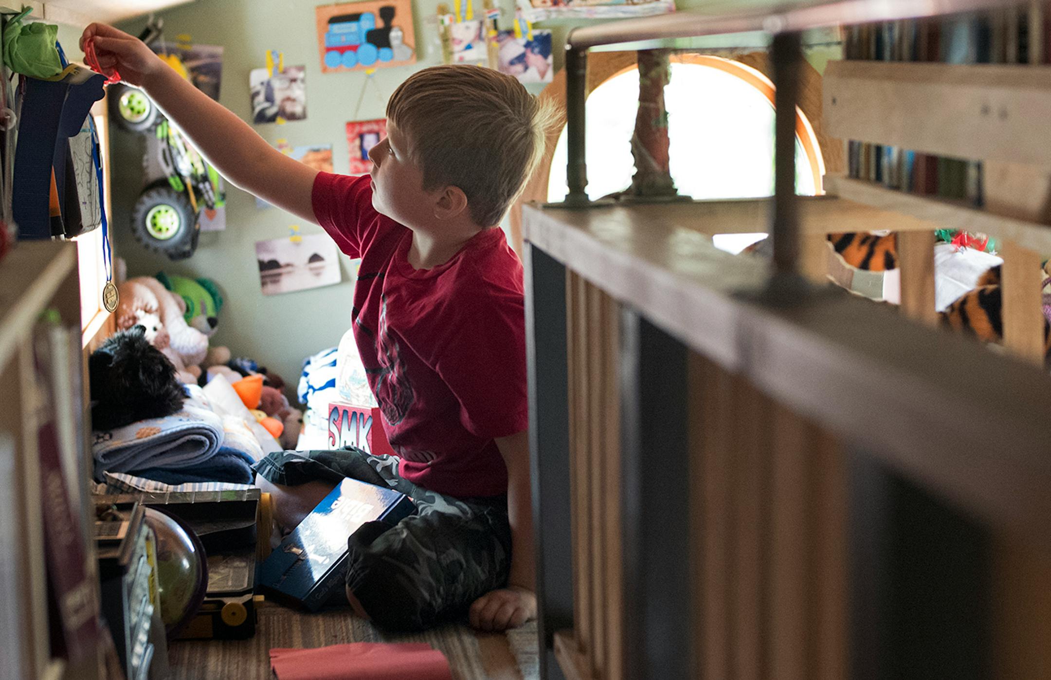 Sully, 7, plays in the loft.