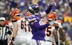 Minnesota Vikings defensive end Brian Robison celebrates after a sack during the first half of an NFL football game against the Cincinnati Bengals, Su