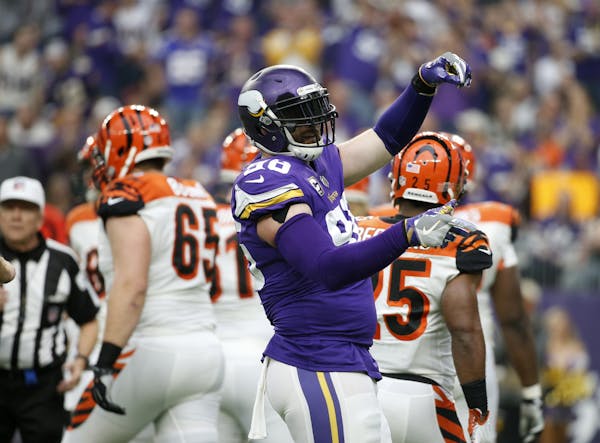 Minnesota Vikings defensive end Brian Robison celebrates after a sack during the first half of an NFL football game against the Cincinnati Bengals, Su