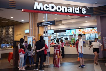 Customers place orders at a McDonald's restaurant in Kuala Lumpur, Malaysia.