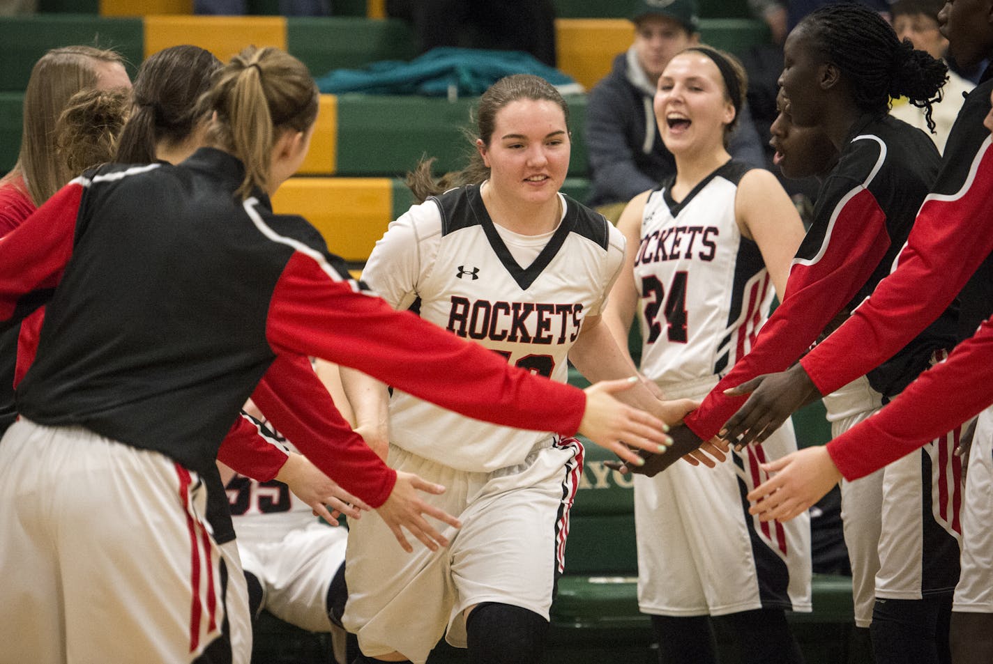 Rochester John Marshall forward Jamie Ruden (52) high fived her teammates as she was introduced before Tuesday night's game against Rochester Mayo. Ruden scored 23 points in Rochester Marshall's 56-46 loss to Rochester Mayo. ] (AARON LAVINSKY/STAR TRIBUNE) aaron.lavinsky@startribune.com The Rochester John Marshall girls basketball team played a game at Rochester Mayo on Tuesday, Feb. 9, 2016 in Rochester, Minn.