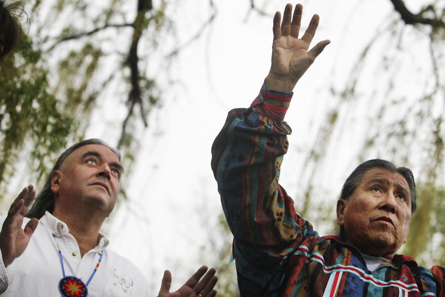 Chris Mato Nunpa, right, and Jim Anderson held a news conference on Thursday. "We're expecting to get arrested," Mato Nunpa said of the decision to net on Cedar Lake. "If we don't, we'll be disappointed."