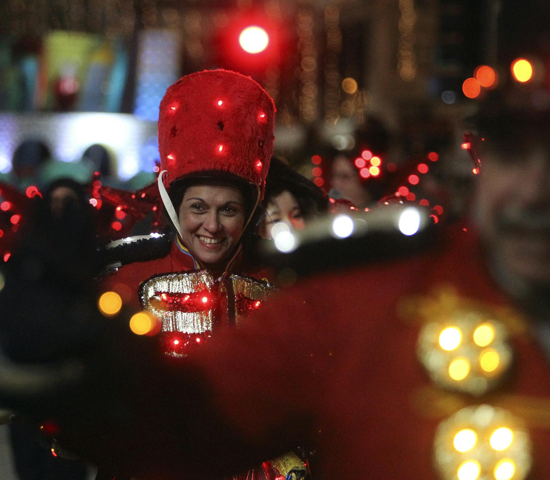 Folks dressed as toy soldiers from the Holidazzle float mustered up smiles despite bitter cold temps to the kickoff of the Target Holidazzle parade Friday, Nov. 23, 2012, in Minneapolis, MN.] (DAVID JOLES/STARTRIBUNE) djoles@startribune.com The Target Holidazzle parade kicked off in downtown Minneapolis Friday, Nov. 23, 2012.