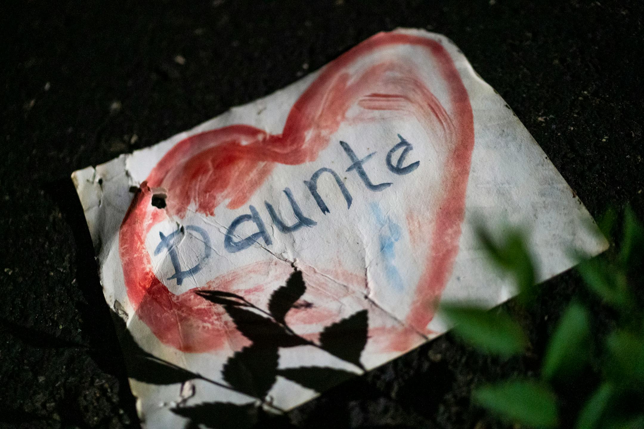 A drawing of Daunte Wright's name lays on the ground as festivities conclude at the Daunte Wright Memorial during a Fourth of July celebration in his honor on Sunday, July 4, 2021, in Brooklyn Center. The Holiday was Wright's favorite celebration of the year.     ]   ANTRANIK TAVITIAN • anto.tavitian@startribune.com