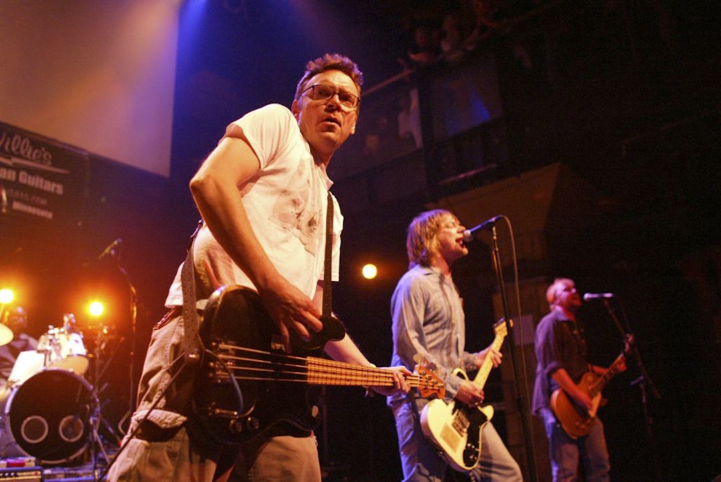 Soul Asylum bassist Karl Mueller, left, performing with his bandmates Dave Pirner and Dan Murphy, right, at a benefit in October of 2004 to raise money to help defray Mueller's medical expenses.