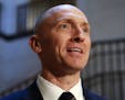 FILE - In this Nov. 2, 2017, photo, Carter Page, a foreign policy adviser to Donald Trump's 2016 presidential campaign, speaks with reporters followin