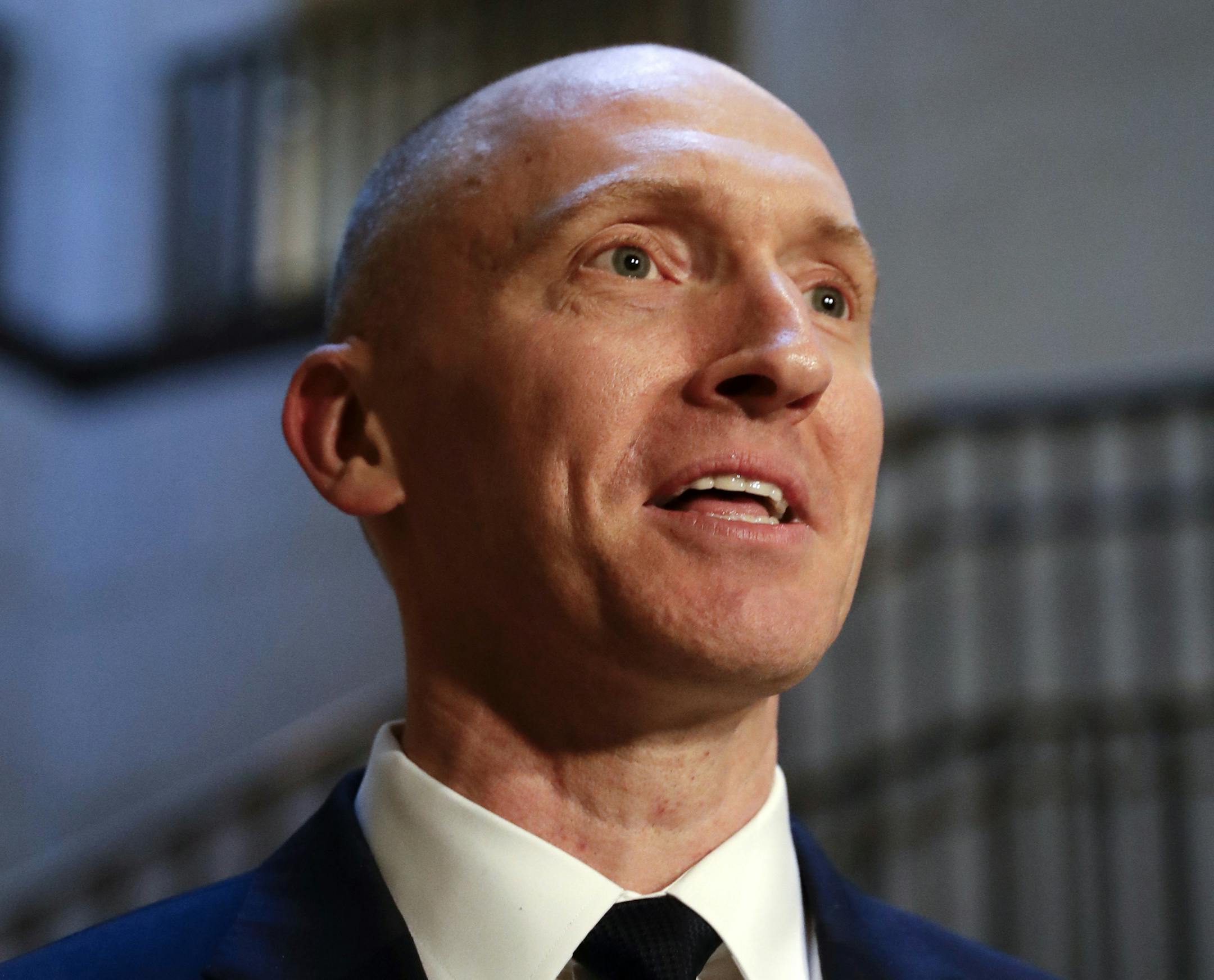 FILE - In this Nov. 2, 2017, photo, Carter Page, a foreign policy adviser to Donald Trump's 2016 presidential campaign, speaks with reporters following a day of questions from the House Intelligence Committee, on Capitol Hill in Washington. (AP Photo/J. Scott Applewhite)