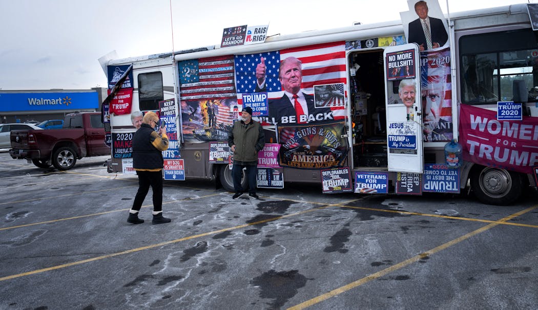 Cyndi Shell photographed her husband Scott in front of an RV selling former president Donald Trump merchandise Friday in a Walmart parking lot in Concord, N.H. “I have a lot of respect for Dean Phillips,