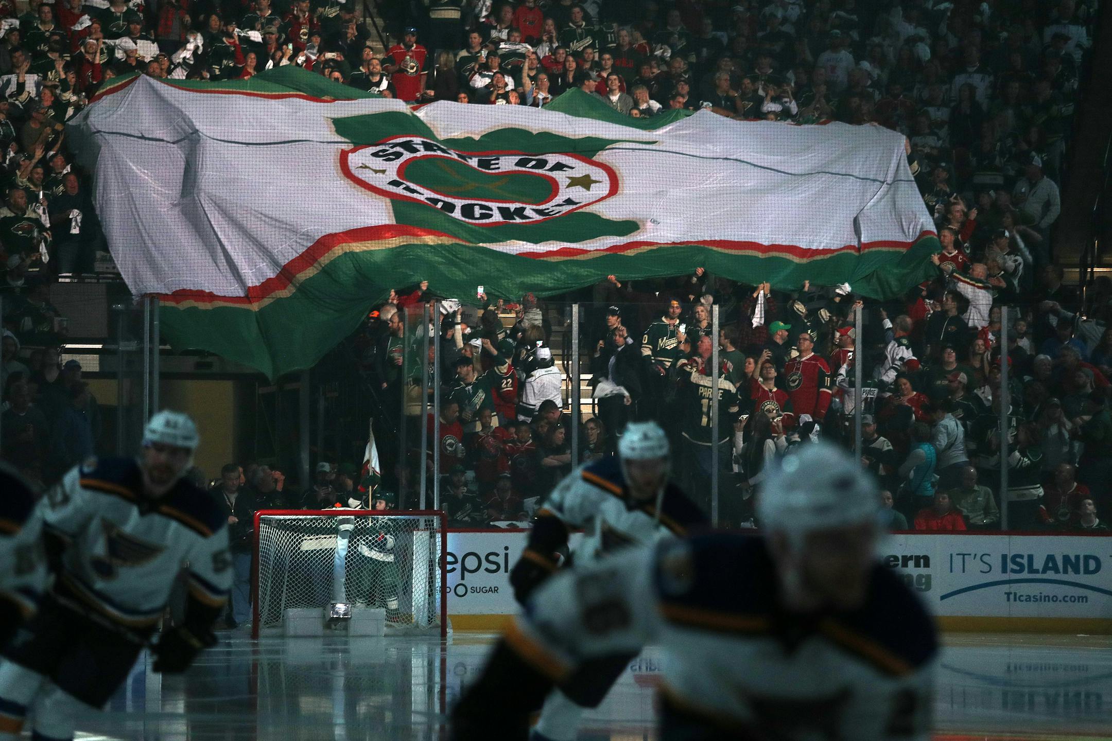 Fans at Xcel Energy Center passed around the State of Hockey flag during last season's playoffs.