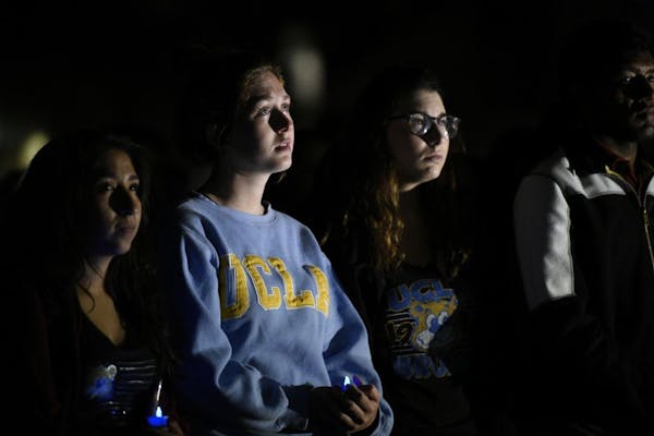 Students attended a candlelight vigil for Prof. William Klug at the University of California, Los Angeles, on Thursday night in Los Angeles. A former 