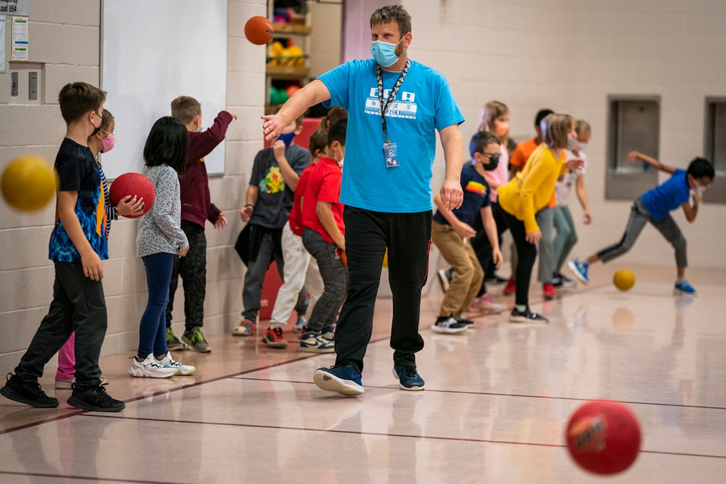 Craig Nilles substitute teaches a physical education class at Woodland Elementary School Tuesday, Oct. 26, 2021 in Eagan, Minn. The substitute teacher shortage continued this fall, with districts reporting more need than ever and hundreds fewer candidates to step up when teachers are ill or need the day off. ] LEILA NAVIDI • leila.navidi@startribune.com