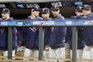 Twins players, including injured center fielder Byron Buxton (middle), wore some grim faces during the ninth inning of an ALDS Game 3 loss to the Yank