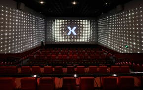 A demo video loop of Screen X technology plays in an empty theater before a special screening April 30, 2025, at Marcus Southbridge Crossing Cinema in