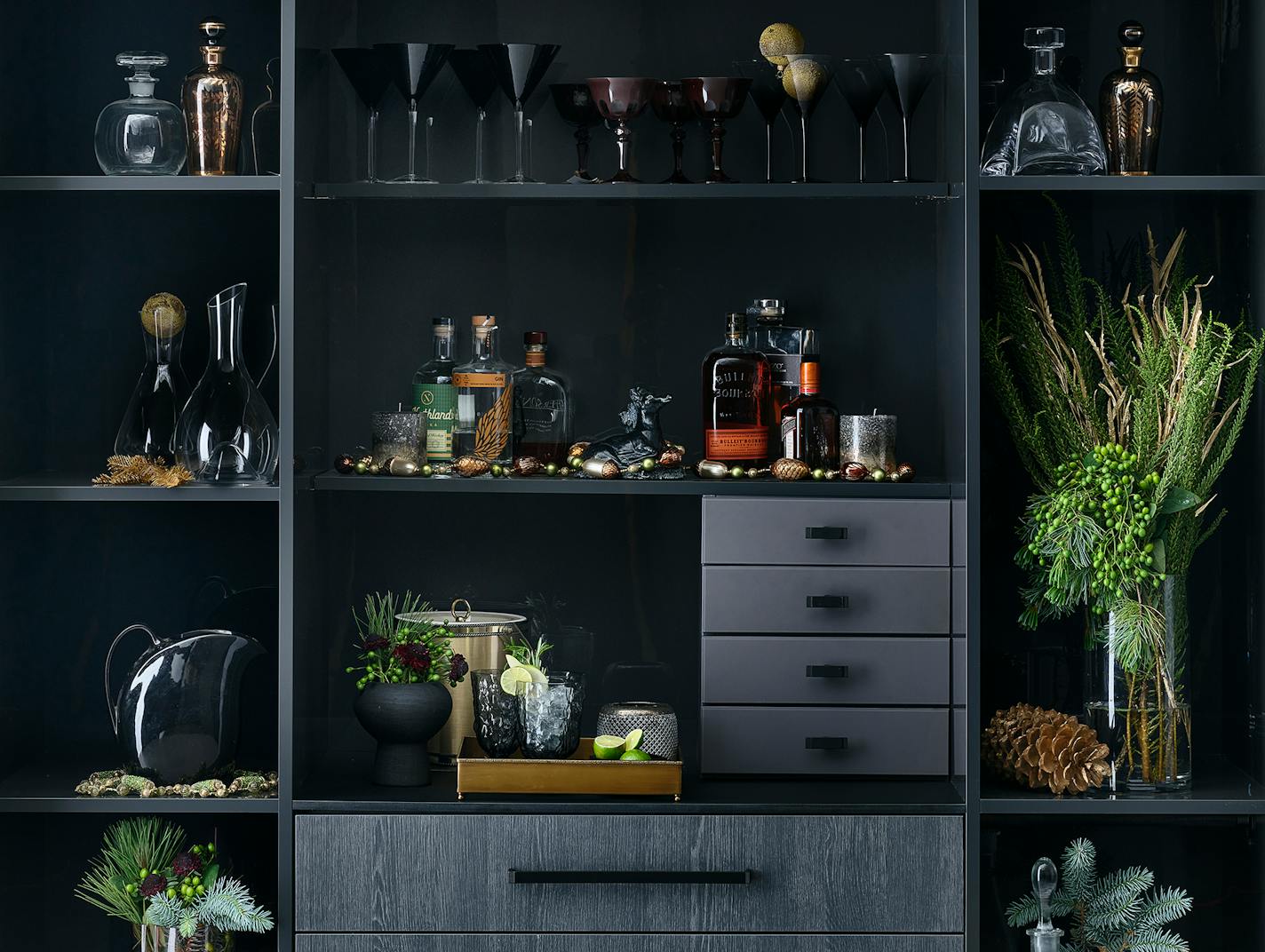 Build a festive holiday bar with doors, drawers and shelves made to fit your space. Fill with vintage or new glassware, liquor and greenery to ring in the New Year. Interior designer and stylist Barbara Schmidt, studiobstyle.com