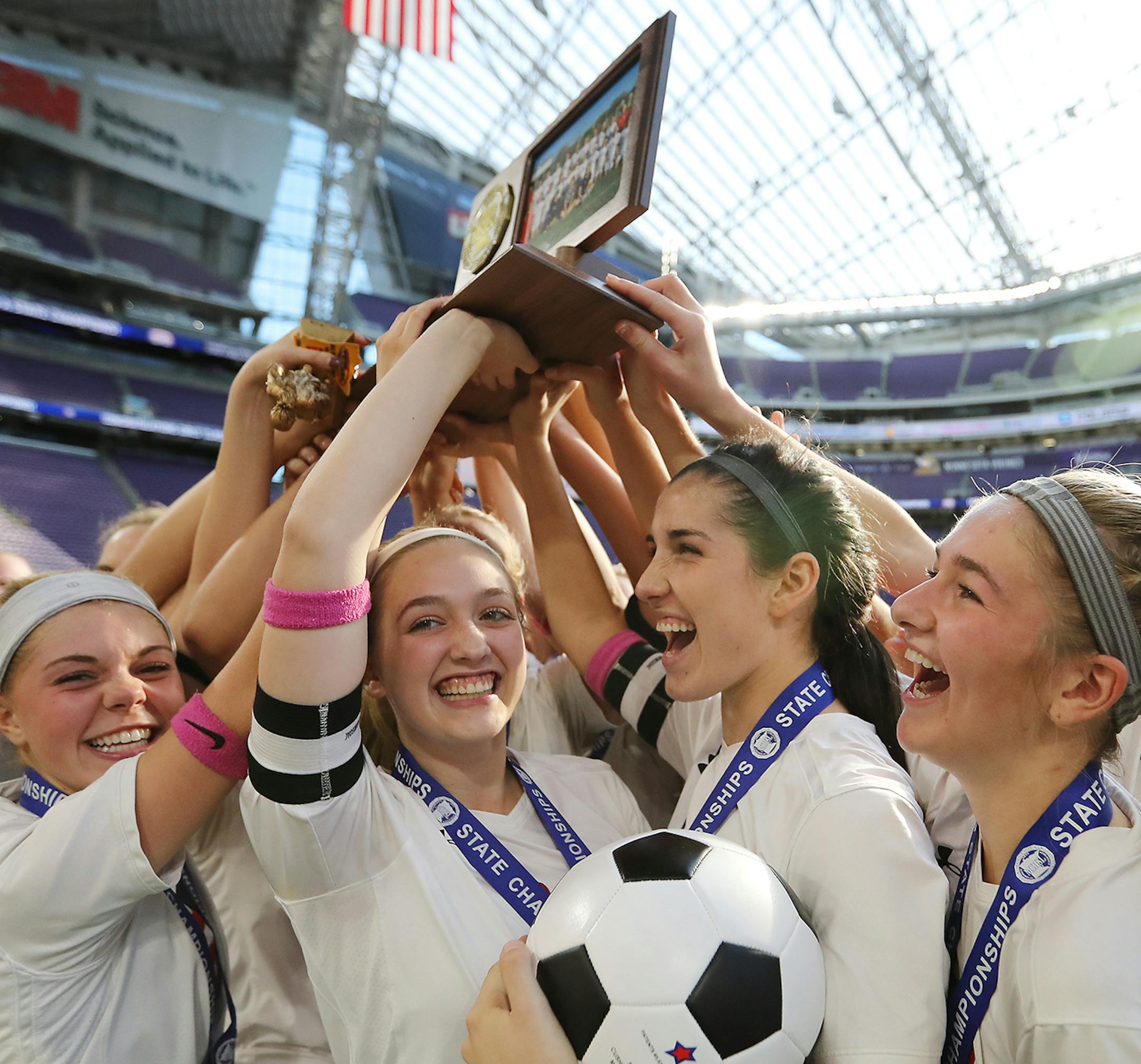 Benilde-St. Margaret's players celebrate their championship. ] (Leila Navidi/Star Tribune) leila.navidi@startribune.com BACKGROUND INFORMATION: Class 1A girls soccer championships between Mankato West and Benilde-St. Margaret's at U.S. Bank Stadium in Minneapolis on Thursday, November 3, 2016. Benilde-St. Margaret's won the game 2-1.