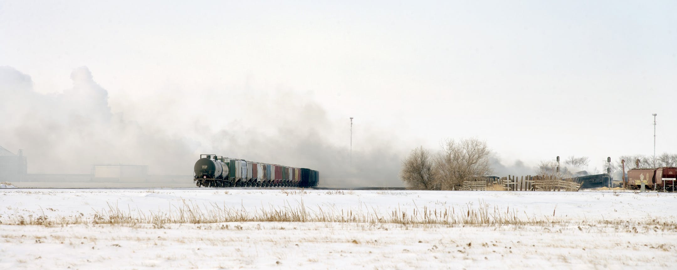 Crude oil tanker cars continue to burn at the site of an oil train derailment Tuesday, Dec 31, 2013, in Casselton, N.D. The train carrying crude oil derailed and exploded on Monday. (AP Photo/Bruce Crummy)