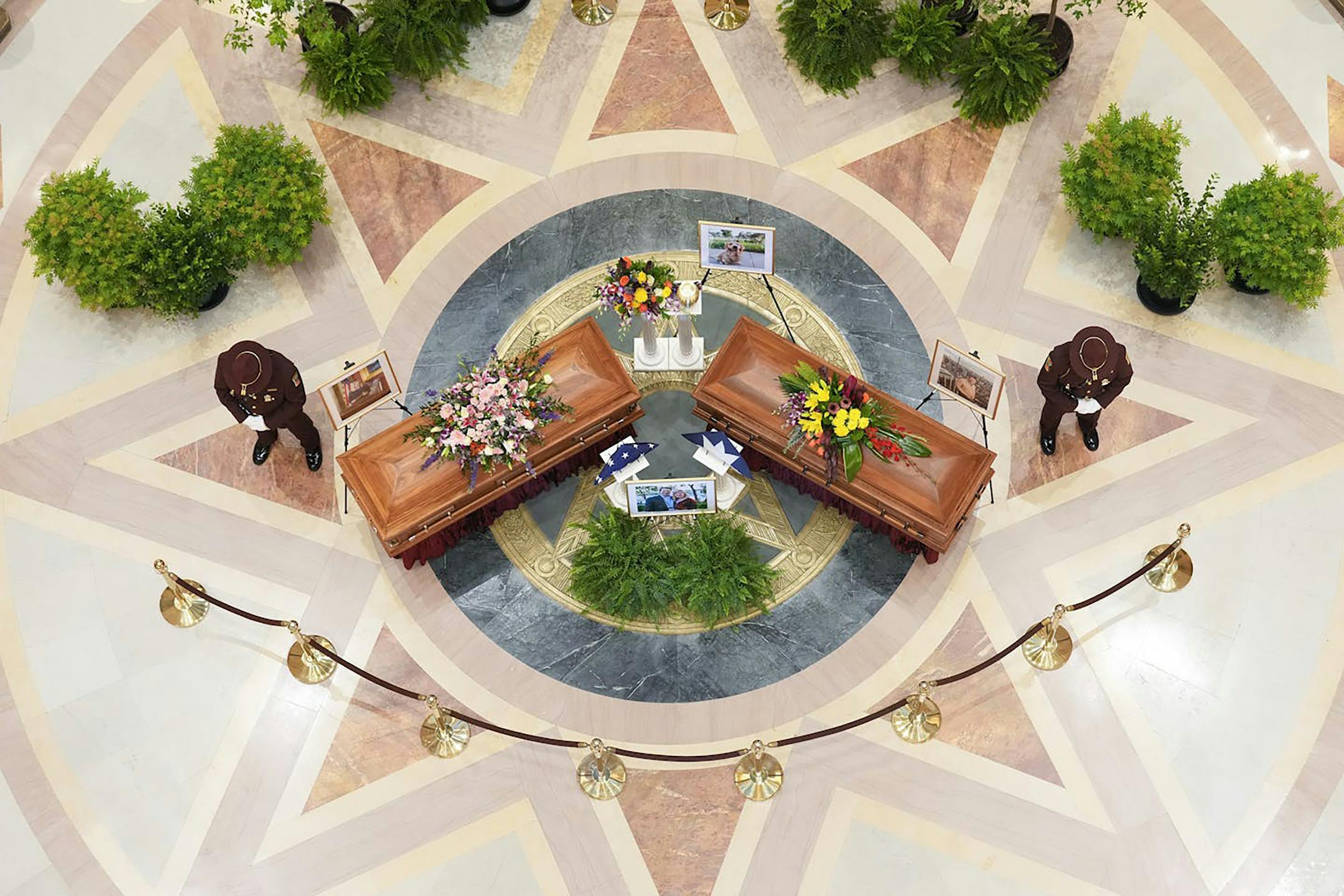 Minnesota State Rep. Melissa Hortman, her husband, Mark, and their dog, Gilbert, lie in state at the state Capitol in St. Paul on June 27, 2025.