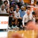 Coach Joe Hyser, with his team and coaches, kept an eye on the progress of the Minneapolis South boys basketball team. Eight players transferred from 
