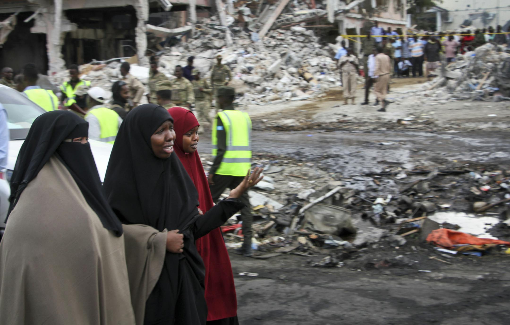 Somali women react at the scene of Saturday's blast, in Mogadishu, Somalia Sunday, Oct. 15, 2017. The death toll from the most powerful bomb blast witnessed in Somalia's capital rose Sunday to at least 189 with more than 200 injured, making it the deadliest single attack ever in the Horn of Africa nation, police and hospital sources said. (AP Photo/Farah Abdi Warsameh)