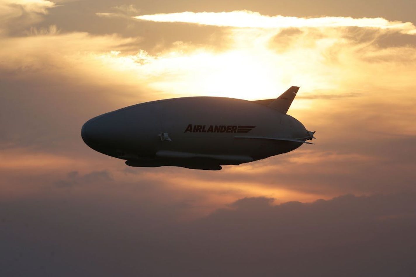 The Airlander 10 in flight, after taking off from Cardington airfield in Bedfordshire, England, Wednesday Aug. 17, 2016. A blimp-shaped airship billed as the world's largest aircraft has taken off for the first time, days after an earlier attempt was scuttled by a last-minute technical hitch. The 302-foot (92-meter) Airlander 10 � nicknamed the "flying bum" because of its bulbous front end � rose slowly into the air Wednesday from an airfield 45 miles (73 kilometers) north of London.