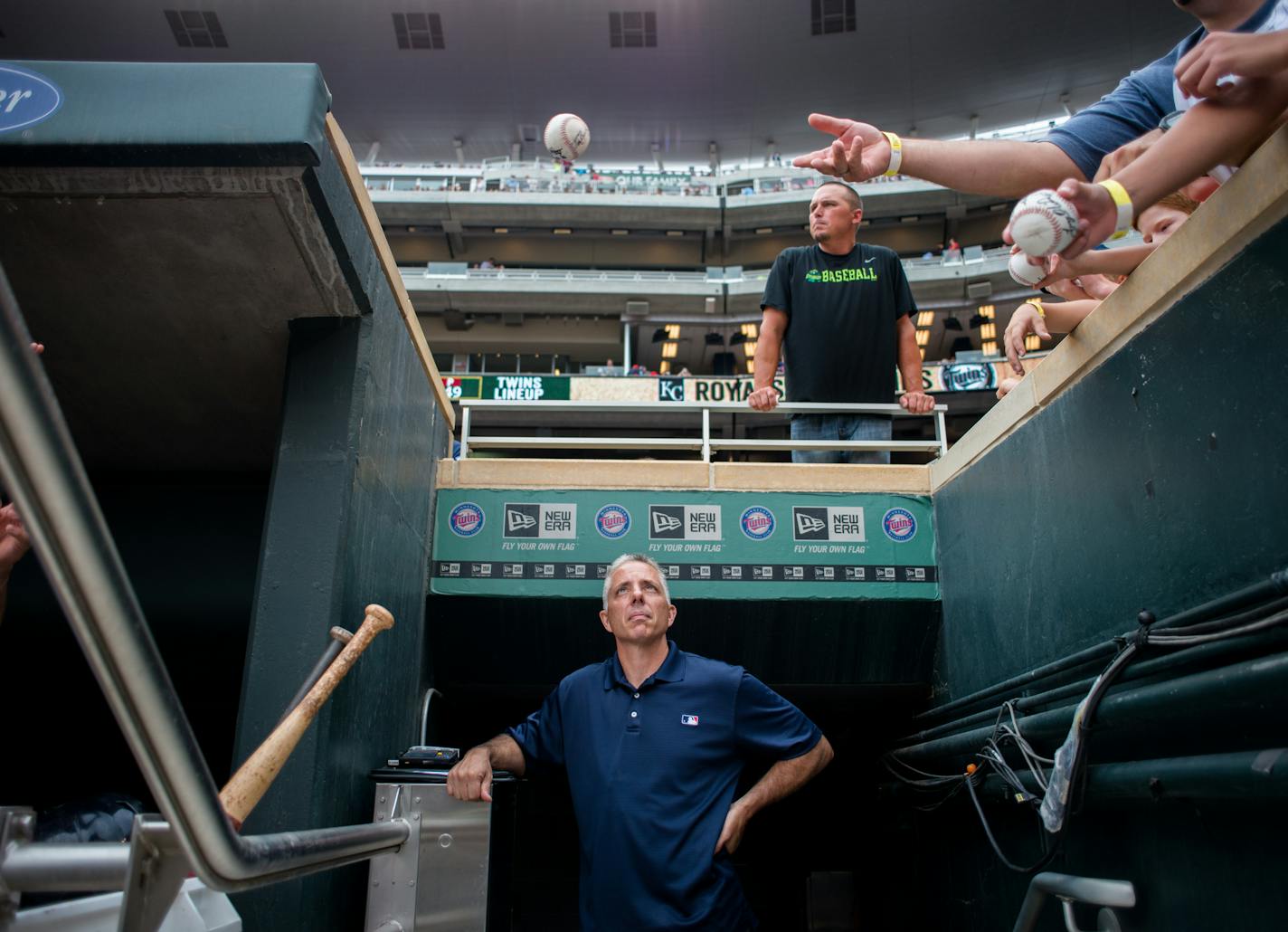 AUTH090114 * 20035859A * 964956 * Mark Vancleave - mark.vancleave@startribune.com * Twins authenticator Steven Bantle collects and tags game memorabilia during a Twins-Royals game Sun. Aug. 17, 2014 at Target Field. [Fans receive autographs from Twins players before the start of Sunday's game.]