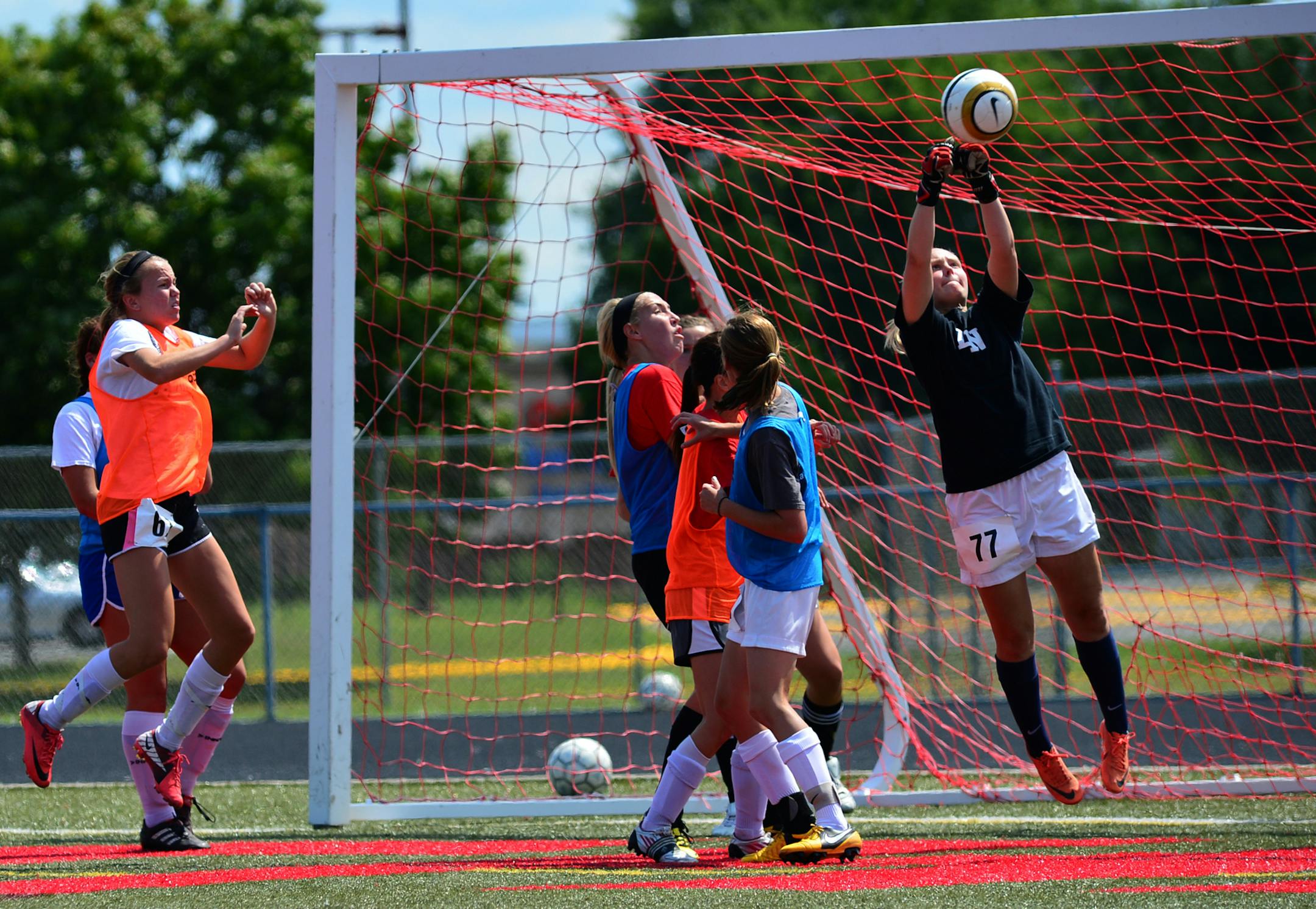 Lakeville North girls' soccer goalkeeper and co-captain Alexis Joyce, right, made a save Monday. The Panthers want to make the next step after losing in the state semifinals two years in a row.