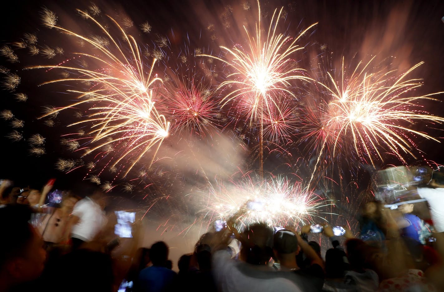 Revelers in the Philippines. Fireworks are big in many countries on New Year's Eve.