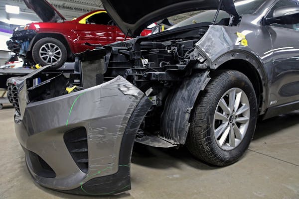 A Kia damaged after being stolen is seen at an auto repair shop in Milwaukee in January 2021.