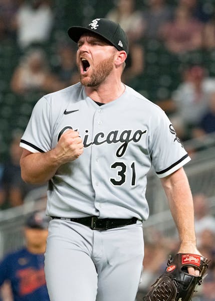 Chicago White Sox relief pitcher Liam Hendriks (31) celebrates after the final out in the bottom of the ninth against the Minnesota Twins.