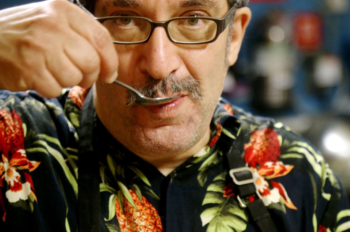 Judah Nataf, who makes the two vegetarian soupls daily, does a taste test of the lentil herb soup before lunch customers come in at the Soup for You! Cafe on Tuesday at Bethany Lutheran Church in Minneapolis.