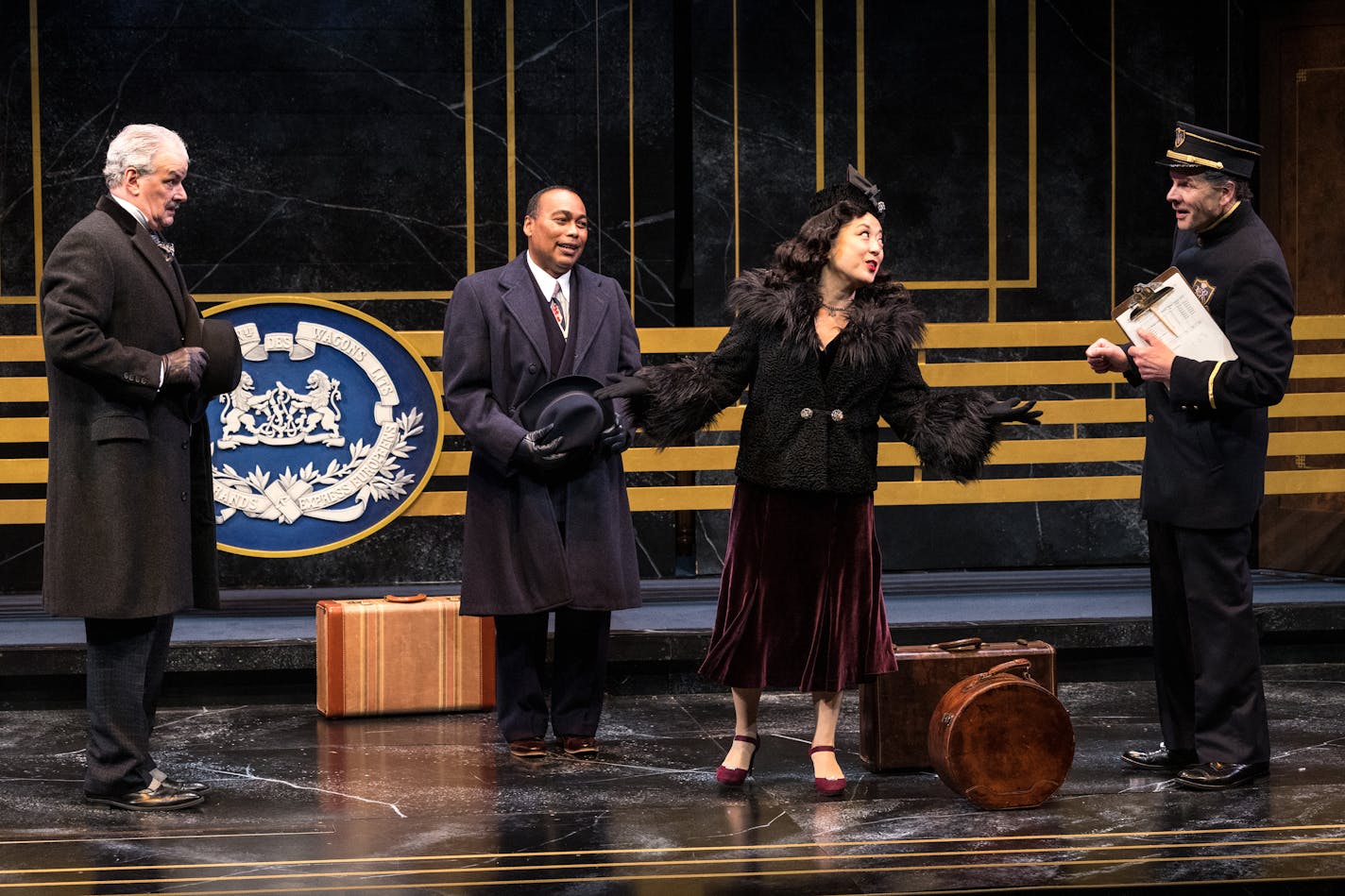 Andrew May, Gavin Lawrence, Katie Bradley and Robert Johansen onstage in the Guthrie Theater's "Murder on the Orient Express."