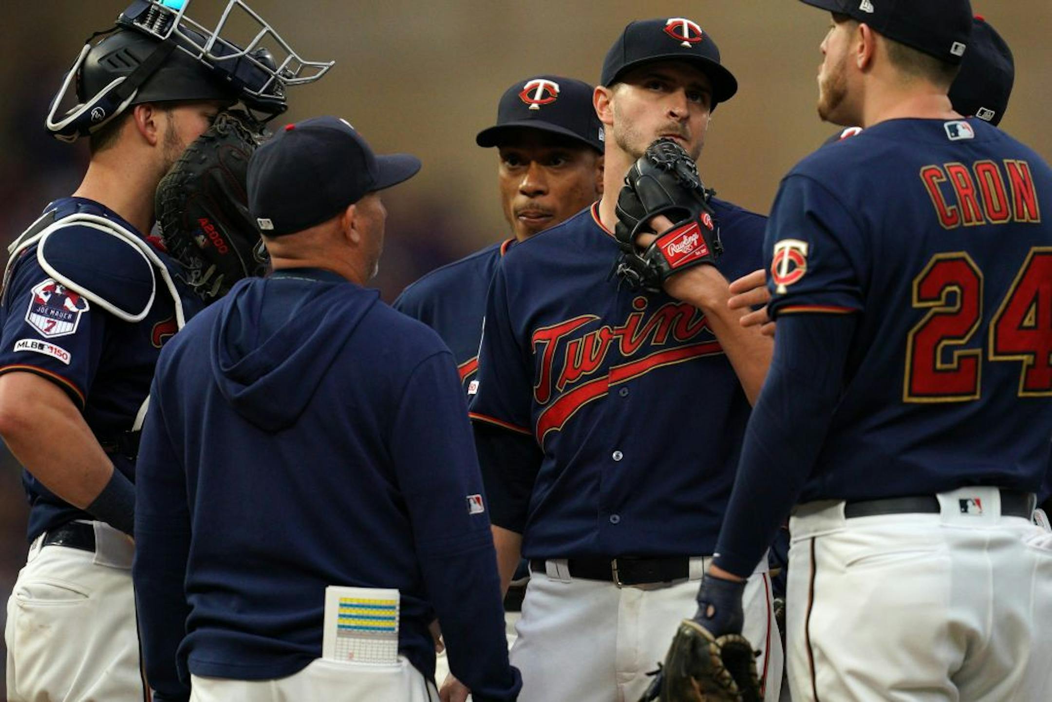 Minnesota Twins starting pitcher Jake Odorizzi (12) got a visit to the mound by Minnesota Twins pitching coach Wes Johnson (47) in the fifth inning.