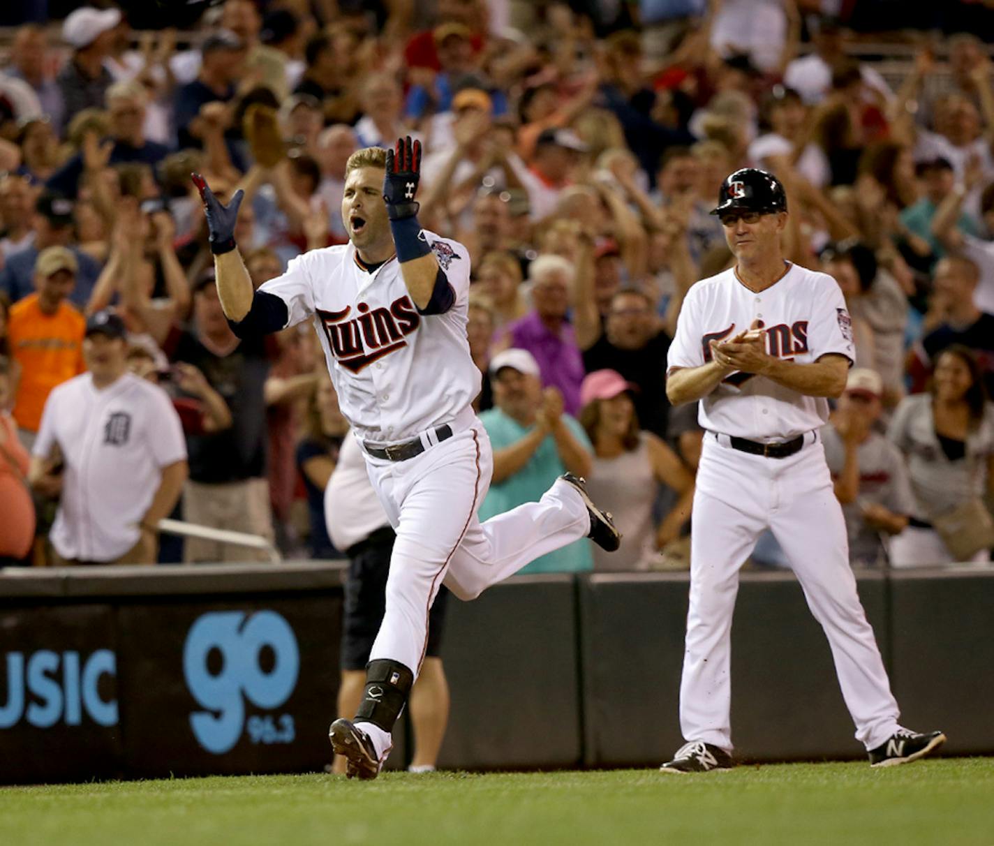 The Twins' Brain Dozier celebrated his walkoff home run rounding third base.