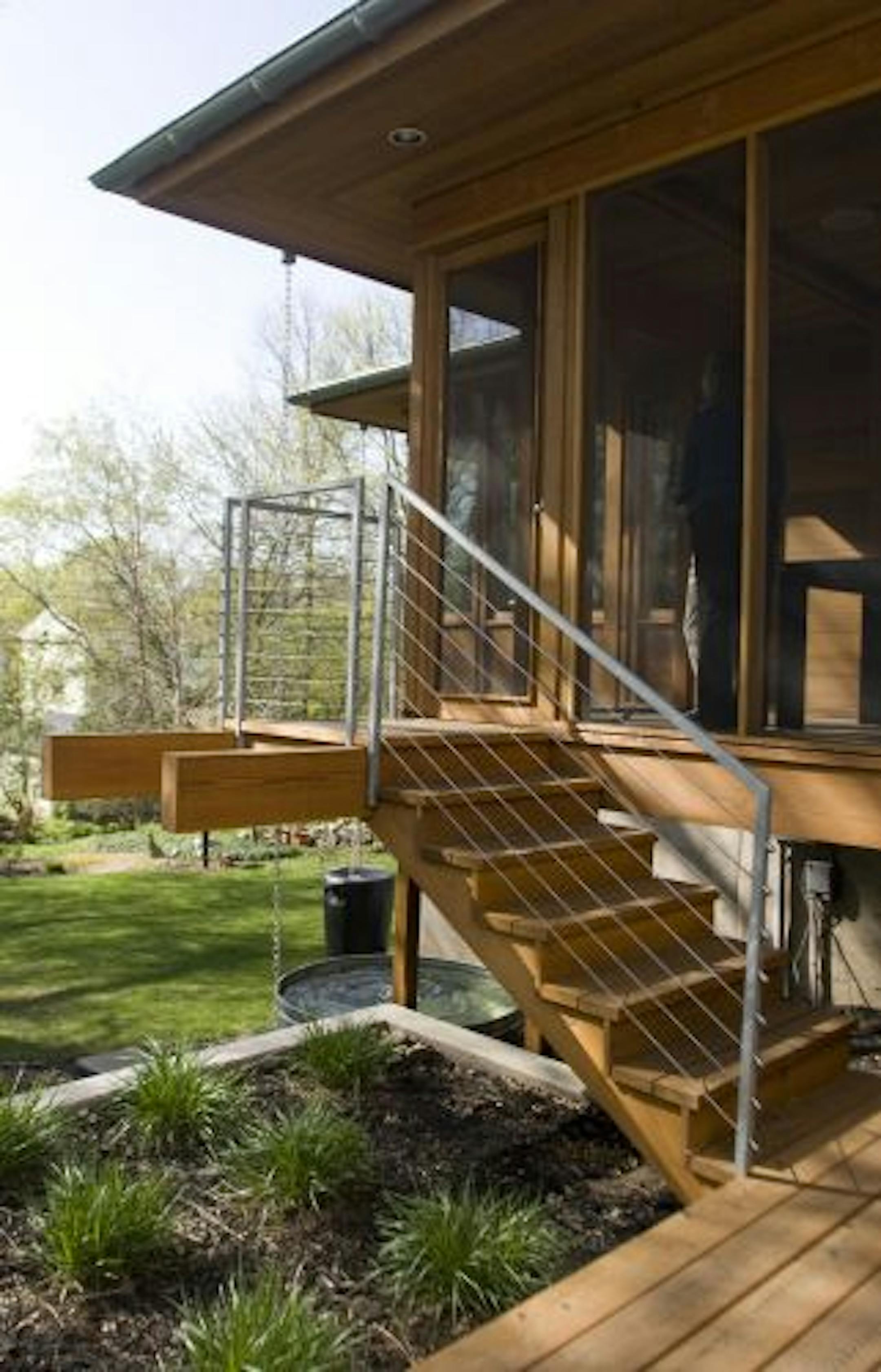 Now it's easier to get to the back yard. The new screened porch staircase leads down to the backyard garden.
